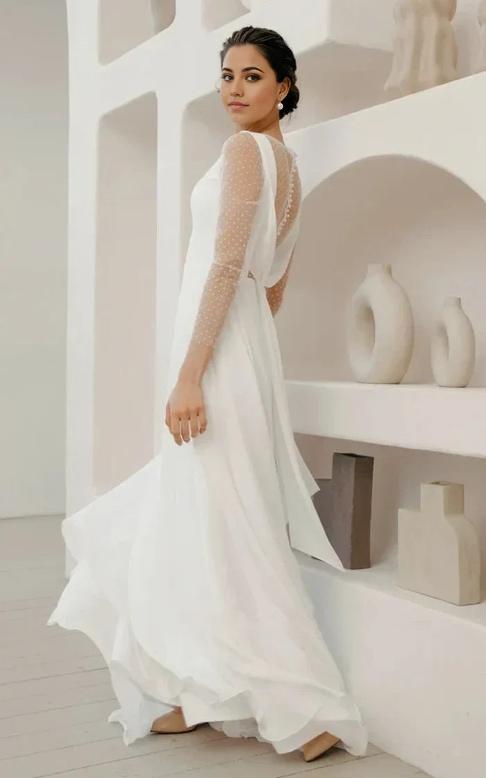 Vestido de novia minimalista de gasa con mangas abullonadas y botones de perla en la espalda baja